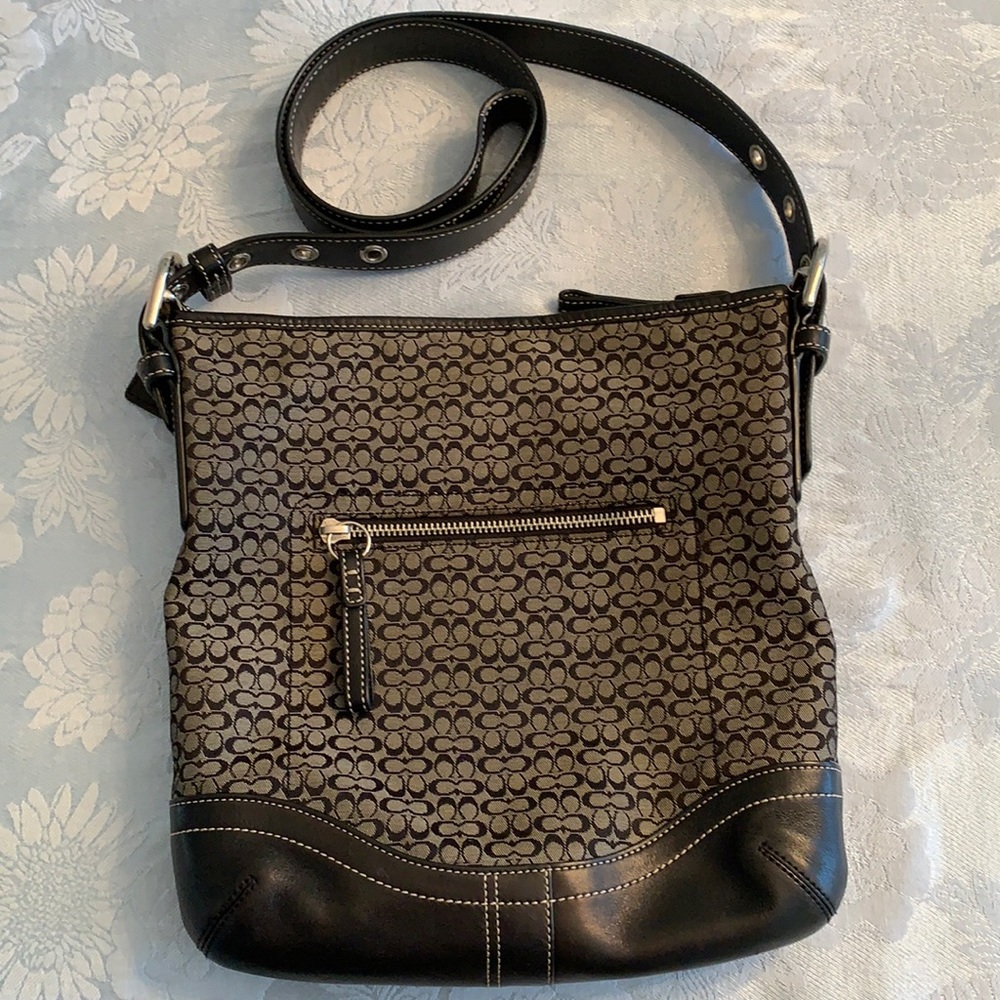 Coach black crossbody with CC monogram design.